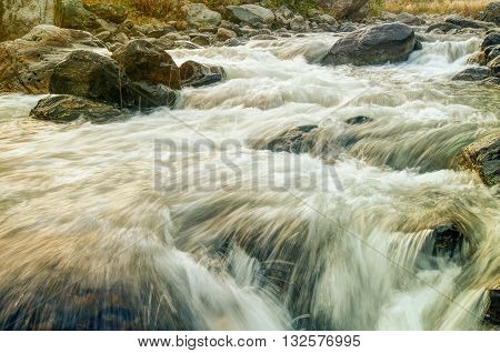 Beautiful Reshi River water flowing through stones and rocks at dawn Sikkim India. Reshi is one of the most famous rivers of Sikkim flowing through the state and serving water to many local people.