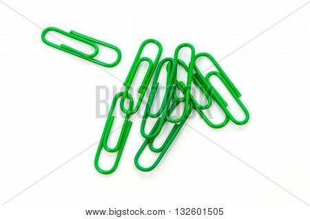 Green paper clip isolated on white background