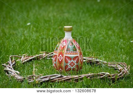 Decorative bottles mid woven wooden wreath. Decor