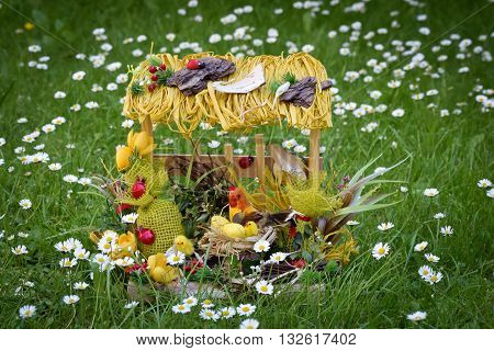Easter decoration, hen with chickens in the hen house