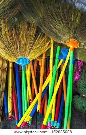Colorful sorghum brooms in market in Thailand