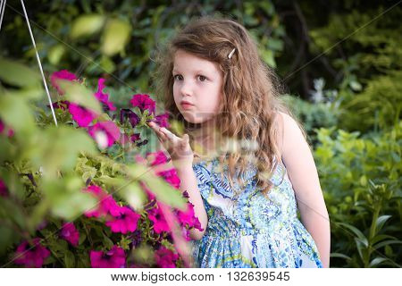cute girl smells wonderful aroma pink flowers