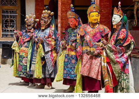 LAMAYURU INDIA - JUNE 13 2015: Unidentified buddhist lamas dressed in mystical mask dancing Tsam mystery dance in time of Yuru Kabgyat Buddhist festival at Lamayuru Gompa Ladakh North India