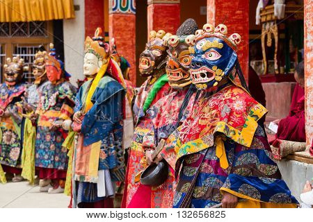 LAMAYURU INDIA - JUNE 13 2015: Unidentified buddhist lamas dressed in mystical mask dancing Tsam mystery dance in time of Yuru Kabgyat Buddhist festival at Lamayuru Gompa Ladakh North India