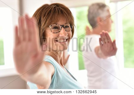 Senior people doing stretching exercices