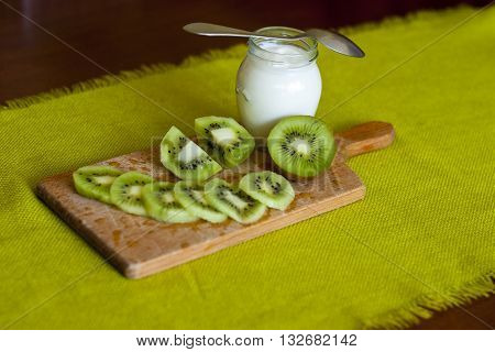 Healthy nutritious snack or breakfast on wood and green background