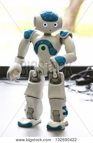 Sofia, Bulgaria - June 1, 2016: A small robot with human face and body - humanoid. Artificial Intelligence - AI. Blue robot.