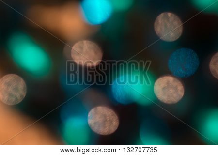 Bokeh round lights of teal and oranges and golds background