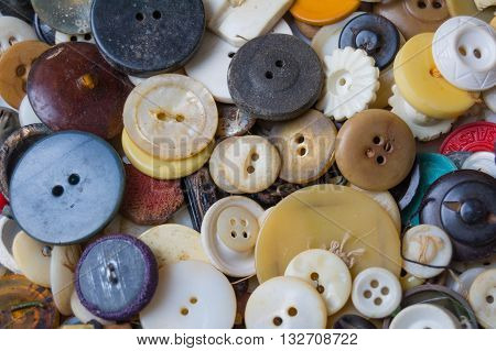 Scattered vintage buttons in different colors for a background