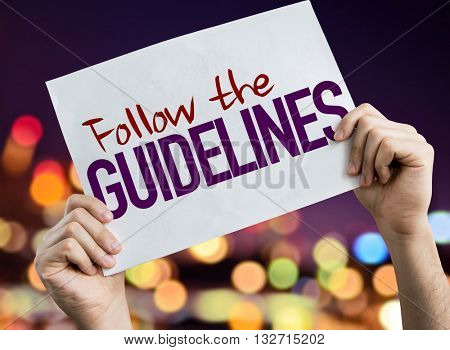 Follow the Guidelines placard with night lights on background