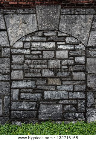 Gray Stone Arch with Red Brick and Green Ivy background image