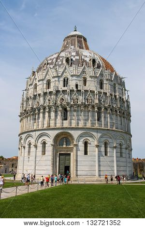 Pisa Italy - June 29 2015: Tourists near the Baptisery of St. John (Battistero di San Giovanni). Province Pisa Tuscany region of Italy