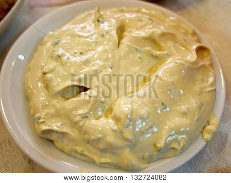 Fresh homemade Tahini - Middle East Arabic Oriental sesame seed paste served on a white plate