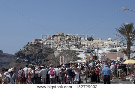 THIRA SANTORINI GREECE - AUGUST 8 2013: A lot of tourists on the streets of Thira. Santorini is always a lot of tourists