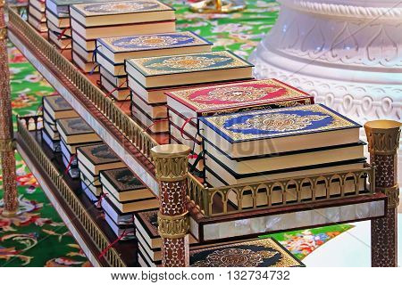 Quran in the mosque lies on the shelves stacks of the book of the Muslim religion Islamic books for sale Arabic Religion