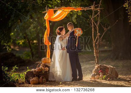 Bride and groom on their wedding fall day