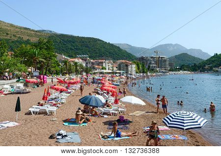 PETROVAC MONTENEGRO - SEPTEMBER 19 2015: Unidentified people are relaxing on the beach in the popular resort town of Petrovac Montenegro