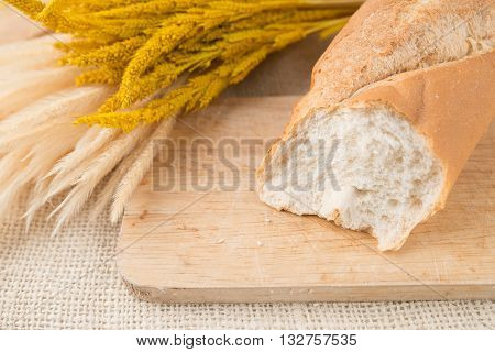 French Bread Baguettes On Bread Board On Burlap Texture