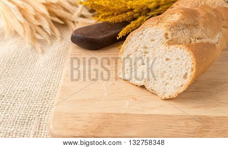 Sharp Sliced Of French Bread Baguettes On Bread Board