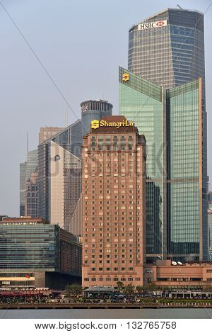 SHANGHAI CHINA - MARCH 25: Pudong district skyscrapers view from The Bund waterfront area on March 25 2016 in Shanghai China. Pudong is a district of Shanghai located east of the Huangpu River.