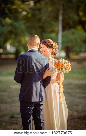 Bride and groom on their wedding fall day
