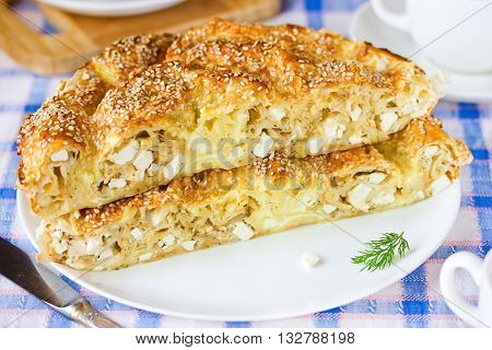 Achma - khachapuri with cheese and dill. Traditional georgian cuisine. Selective focus