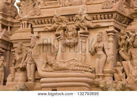 Chettinad India - October 16 2013: Detail of Shiva temple in Thirumayam. Lord Vishnu lies down on the coil of a five headed snake. Image is called Ananta Shesha or Ranganatha.