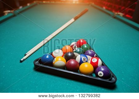 Billiard Balls In A Pool Table At Triangle With Billiard Cue