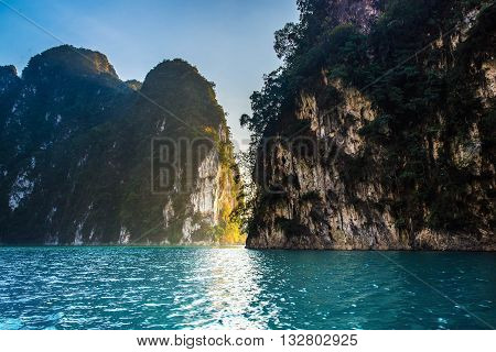 Sunset behind mountain and blue sky at Khaosok Lake Thailand