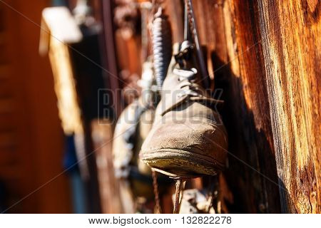 antique old style retro object assemblage on a wooden wall, rustic stile. Old skates