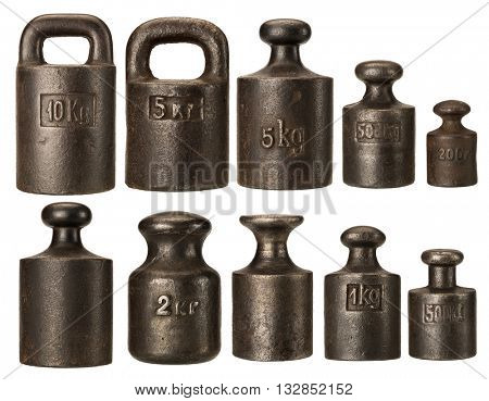 Old rusty iron scale weights isolated on white