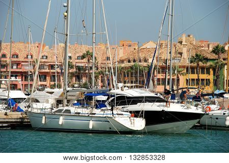 PUERTO SOTOGRANDE, SPAIN - JULY 18, 2008 - Yachts and boats in the marina with buildings to the rear Puerto Sotogrande Cadiz Province Andalucia Spain Western Europe, July 18, 2008.