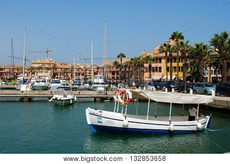 PUERTO SOTOGRANDE, SPAIN - JULY 18, 2008 - Yachts and boats in the marina with buildings to the rear Puerto Sotogrande Cadiz Province Andalucia Spain Western Europe, July 18, 2008.