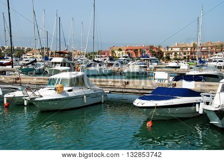 PUERTO SOTOGRANDE, SPAIN - JULY 18, 2008 - Yachts and boats in the marina with buildings to the rear Puerto Sotogrande Cadiz Province Andalucia Spain Western Europe, July 18, 2008.
