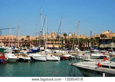 PUERTO SOTOGRANDE, SPAIN - JULY 18, 2008 - Yachts and boats in the marina with buildings to the rear Puerto Sotogrande Cadiz Province Andalucia Spain Western Europe, July 18, 2008.