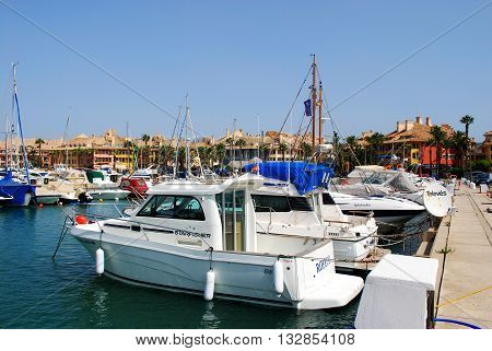 PUERTO SOTOGRANDE, SPAIN - JULY 18, 2008 - Yachts and boats in the marina with buildings to the rear Puerto Sotogrande Cadiz Province Andalucia Spain Western Europe, July 18, 2008.