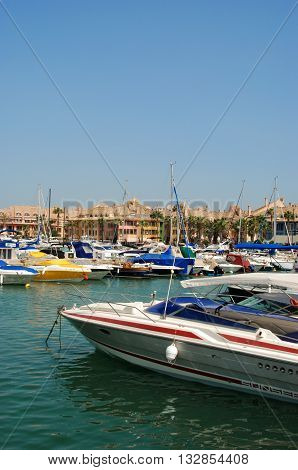 PUERTO SOTOGRANDE, SPAIN - JULY 18, 2008 - Yachts and boats in the marina with buildings to the rear Puerto Sotogrande Cadiz Province Andalucia Spain Western Europe, July 18, 2008.