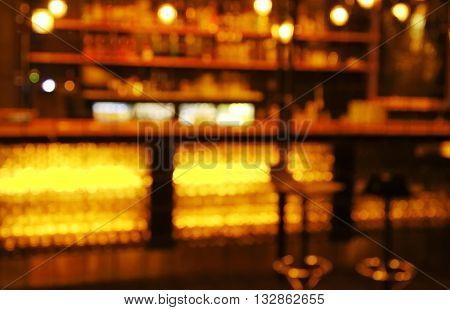 blur stools at counter in bar and restaurant for hanging at dark night