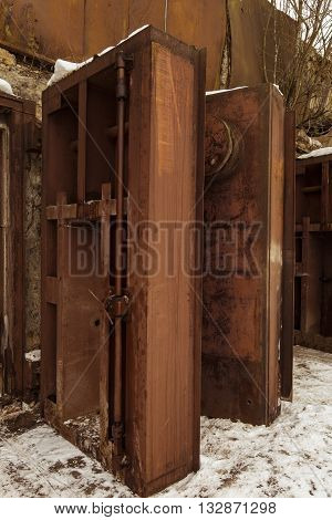 Nuclear bunker. Nuclear bomb shelter. Old abandoned Soviet Cold War bunker in forest. Upcoming reinforced steel hopper gates.