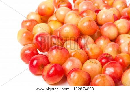 a lot of yellow cherries isolated on white background.