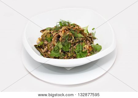 Salad with fern and meat on white background