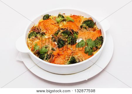 Baked pudding with broccoli isolated on white