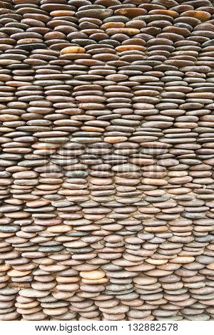 Close up of circle pebble wallabstract background