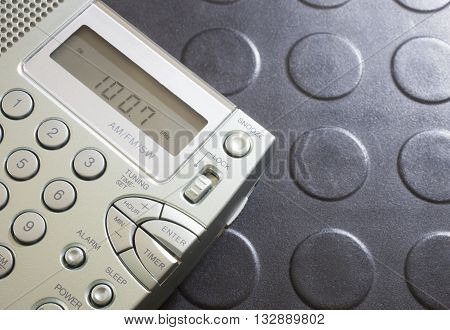 Portrable battery operated radio that is listening to broadcast radio