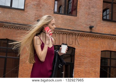 Young Pretty Blond Girl With Phone