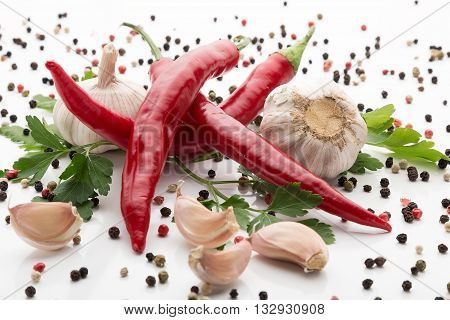 fresh chilli pepper with garlic on white