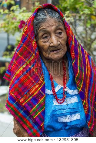 PANCHIMALCO EL SALVADOR - MAY 08 : Portrait of an old Salvadoran woman during the Flower & Palm Festival in Panchimalco El Salvador on May 08 2016