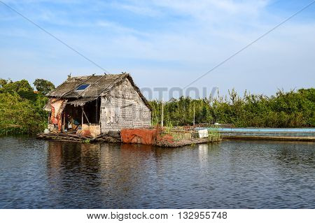 Floating village houses on Tonle Sap Lake in Cambodia.
The houses are relocated a few times each year to gain optimal weather.  Transport is by small boats, some powered by man, some by mechanical means.