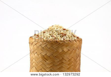 Raw Brown rice in bamboo box (Kratip) on white background