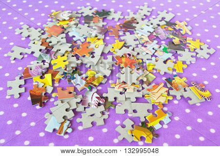 Puzzles on a purple background. Children's puzzle game